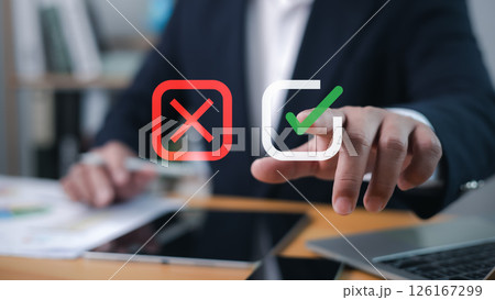 Businessman select green correct sign mark for approve business project proposal concept, Goals achievement and business success. Task completion, Approve and reject business project proposal concept. Businessman select green correct sign mark for approve business project proposal concept, Goals achievement and business success. Task completion, Approve and reject business project proposal concept. 126167299