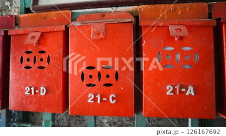 traditional local Hong Kong metal hand painted red mail box with numbers on it traditional local Hong Kong metal hand painted red mail box with numbers on it 126167692