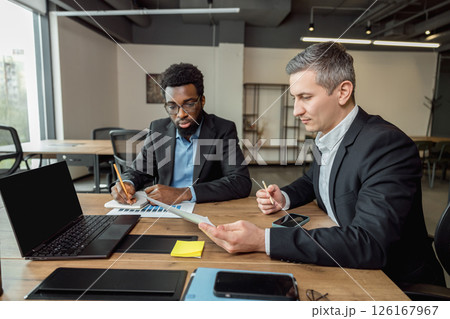 Business consultant talking to the client and looking involved 126167967