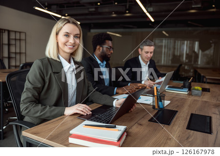 Lawyers working together on the project and looking interested and involved 126167978