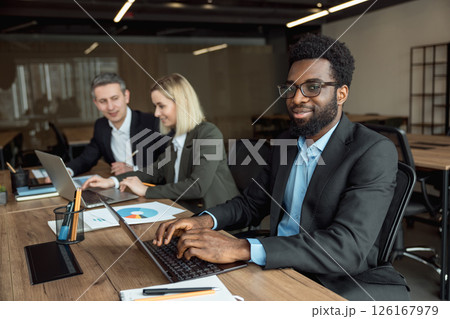 Lawyers working together on the project and looking interested and involved 126167979