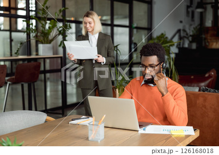 Two business consultants working in the office together 126168018