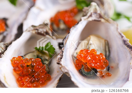 Raw oyster on white background 126168766