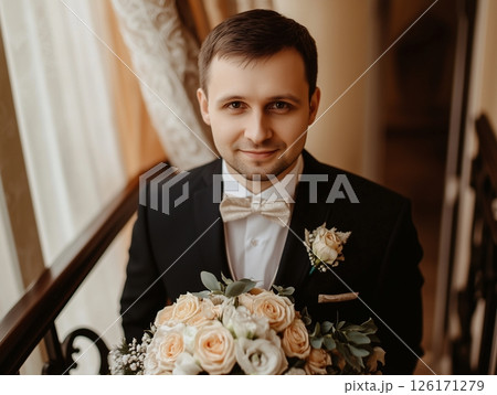 Groom in wedding suit with boutonniere, stylish and elegant look for the special day. Groom in wedding suit with boutonniere, stylish and elegant look for the special day. 126171279