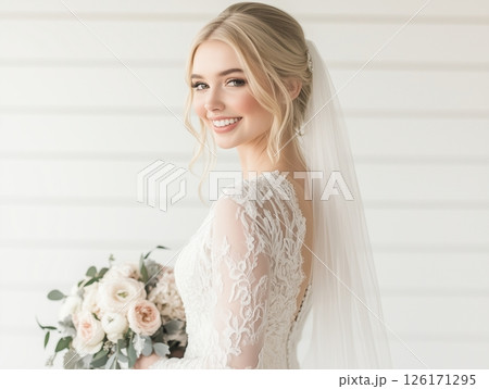 Blonde bride in white dress with veil and bouquet, standing in three-quarter turn, elegant pose. Blonde bride in white dress with veil and bouquet, standing in three-quarter turn, elegant pose. 126171295