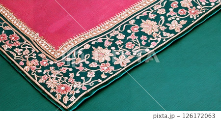 Exquisite Pink and Teal Embroidered Saree Border Detail Indian Textile Close up 126172063