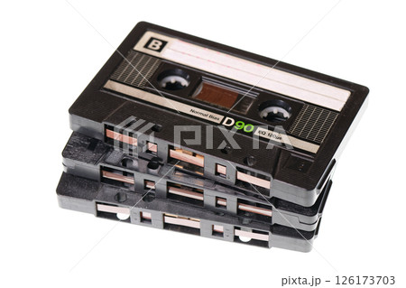 Stack of retro audio cassettes isolated on white background Stack of retro audio cassettes isolated on white background 126173703