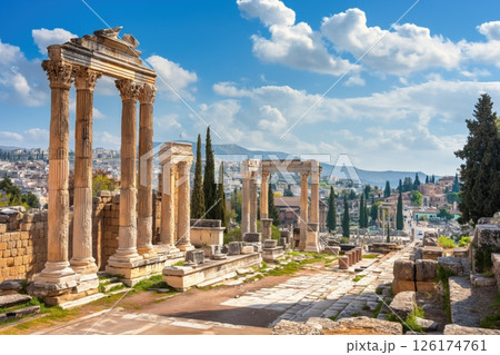 Sunny cityscape of athens, greece, featuring ancient ruins and standing columns 126174761
