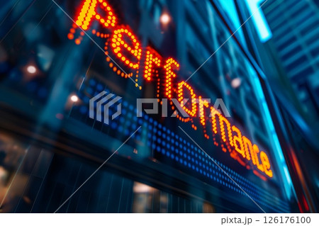 Vibrant neon signage spelling out 'performance' reflects the pursuit of excellence in a dynamic business setting 126176100