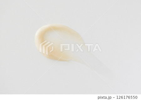 Minimalist beige smear cream on white background Minimalist beige smear cream on white background 126176550