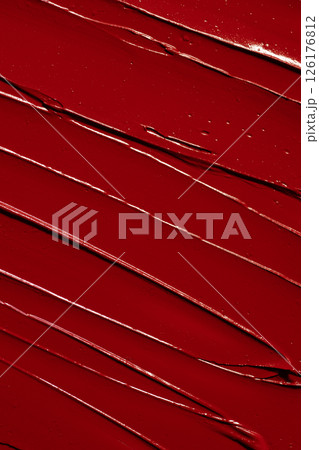 Vibrant red lipstick texture for beauty and cosmetic themes. Red lipstick background for beauty concept. Vibrant red lipstick texture for beauty and cosmetic themes. Red lipstick background for beauty concept. 126176812
