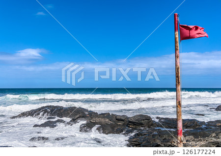 Red flag on Playa La Fuente beach, Gran Canaria, Canary Islands 126177224