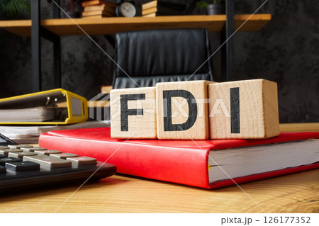FDI foreign direct investment on notebook symbolizing global capital flow. 126177352