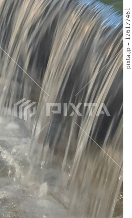 Waterfall with a lot of water coming out of it Waterfall with a lot of water coming out of it 126177461