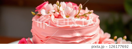 Delightful pink floral cake adorned with fresh blooms for a special celebration or gathering Delightful pink floral cake adorned with fresh blooms for a special celebration or gathering 126177692