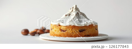 Delicious cake topped with meringue and decorated with confectioners sugar, perfect for any celebration or dessert table Delicious cake topped with meringue and decorated with confectioners sugar, perfect for any celebration or dessert table 126177843