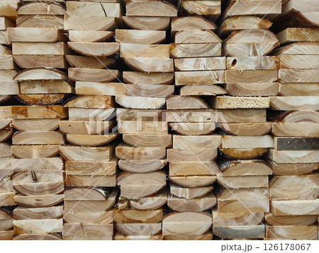 Stacked Wooden Logs Arranged in Neat Horizontal Alignment Close-Up 126178067