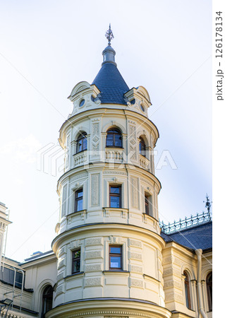 Minimalist architecture building facade of old historic house exterior. Decorative ornamental design elements of classic European style apartment building front view 126178134