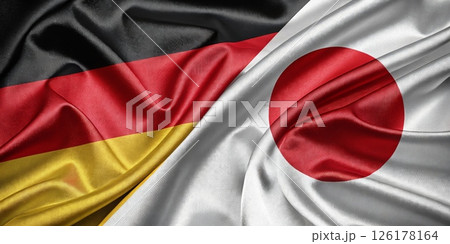 Waving German and Japanese Flags Symbolizing International Friendship and Unity Waving German and Japanese Flags Symbolizing International Friendship and Unity 126178164