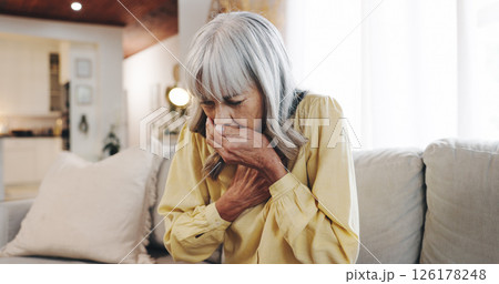Cough, chest pain and sick with old woman on sofa for pneumonia, medical emergency and asthma. Illness, healthcare risk and lung cancer with senior person in living room at home for breathing crisis Cough, chest pain and sick with old woman on sofa for pneumonia, medical emergency and asthma. Illness, healthcare risk and lung cancer with senior person in living room at home for breathing crisis 126178248