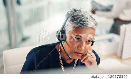 Thinking, office and mature woman in call center with stress for contact us, crm service or customer support. Business, professional consultant and person with headset for problem solving on computer Thinking, office and mature woman in call center with stress for contact us, crm service or customer support. Business, professional consultant and person with headset for problem solving on computer 126178395