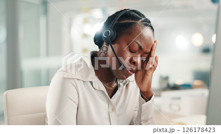Headache, office and black woman in call center with stress for contact us, crm service and customer support. Business, professional consultant and person with headset for fatigue, tired and burnout Headache, office and black woman in call center with stress for contact us, crm service and customer support. Business, professional consultant and person with headset for fatigue, tired and burnout 126178423