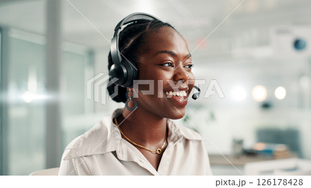 Happy, black woman and consultant with headset at call center for online communication or customer service. Female person, agent or smile with technology, mic or help for virtual assistance at office 126178428