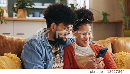 Phone, happy couple and relax in home on internet for social media post, video and financial news. Mobile, man and woman in living room with app for online banking, check account and credit score 126178444