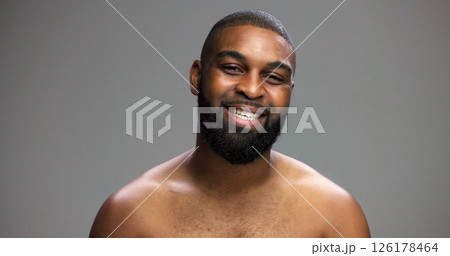 Portrait, cosmetics and black man in studio, smile and dermatology on gray background. African person, mockup space and happy model with skincare, grooming and shine with glow, confidence or wellness Portrait, cosmetics and black man in studio, smile and dermatology on gray background. African person, mockup space and happy model with skincare, grooming and shine with glow, confidence or wellness 126178464