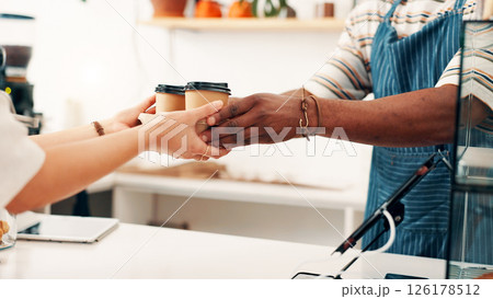 Cafe, coffee and hands of person with customer at counter for serving drinks, latte and cappuccino. Restaurant, hospitality and waiter with takeaway cups for service, store products and pos help 126178512