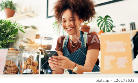 Waitress, smile and phone with woman in cafe for customer order, food delivery and small business. Restaurant, contact and barista person in coffee shop for bakery, communication and catering app 126178632