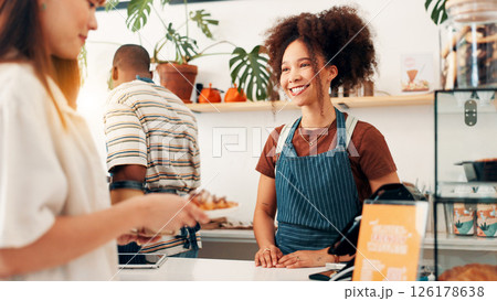 Happy, croissant and woman with customer at cafe counter for serving, help and purchase breakfast. Restaurant, hospitality and waiter with client for pastry, sweet treats and baked food for takeaway 126178638