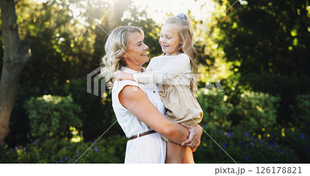 Outdoor, smile and mother with child for carrying, relationship and connection together in park. Happy family, mom and girl with love for bonding, caring and trust on weekend holiday in nature Outdoor, smile and mother with child for carrying, relationship and connection together in park. Happy family, mom and girl with love for bonding, caring and trust on weekend holiday in nature 126178821