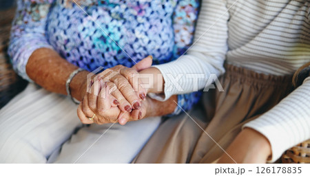 Holding hands, grandma and grandchild in home, closeup or bonding with kid in living room or comfort. Affection, support and family with love in lounge, compassion or care for elderly person in house 126178835