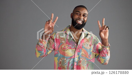 Portrait, peace sign or black man in studio, retro fashion or clothing style on gray background. African person, face or model with hand gesture, v symbol or emoji with vintage outfit or mockup space 126178880