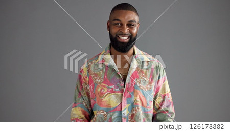 Black man, retro fashion or portrait in studio with smile, confidence or aesthetic for creativity. Person, designer and vintage style on gray background space with happiness, colorful print or unique 126178882