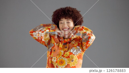 Girl, happy and retro fashion in studio for aesthetic outfit, vintage style and confident personality. Mockup space, woman and smile with floral shirt on gray background for pride or colorful clothes 126178883