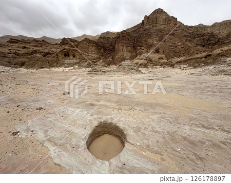The entrance to an ancient copper mine, covered with sand The entrance to an ancient copper mine, covered with sand 126178897