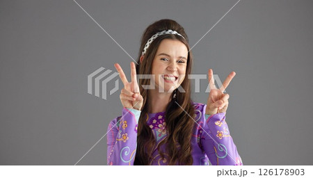Portrait, peace sign or woman with smile, retro fashion or clothes style on gray studio background. Person, face or model with hand gesture, v symbol or emoji with vintage outfit or mockup space 126178903
