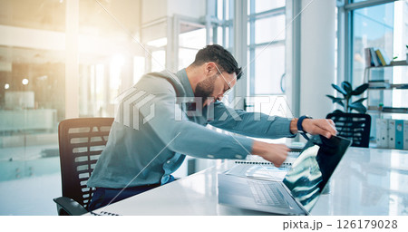 Business, man and punch laptop in office for bad news, pc glitch and frustrated for proposal fail. Angry, male person and violence with tech for software error, property vandalism and mistake tantrum 126179028