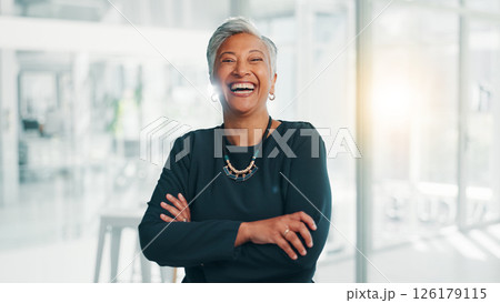 Confidence, business and mature woman laughing in office for investment, venture capital and funny. Professional boss, portrait and happy manager with arms crossed for private equity with experience 126179115