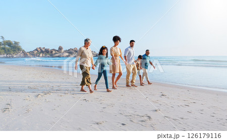 Big family, travel and holding hands with kids on beach for summer holiday, getaway and bonding. Space, people and children on ocean for journey, tropical vacation and generations for adventure trip 126179116