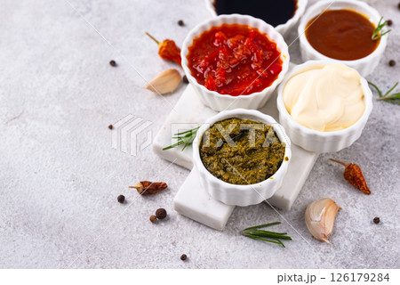Set of different sauces. Ketchup, mustard, pesto Set of different sauces. Ketchup, mustard, pesto 126179284