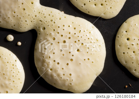baking small pancakes with butter in a frying pan baking small pancakes with butter in a frying pan 126180184
