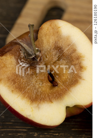 one rotting apple on the table 126180190