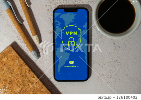 Mobile phone App screen of VPN creation Internet protocols for protection private network Virtual private network anonymous safe and secure internet access on smartphone on workplace background with Mobile phone App screen of VPN creation Internet protocols for protection private network Virtual private network anonymous safe and secure internet access on smartphone on workplace background with 126180402