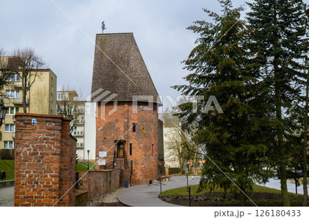 Round tower in the historic surrounding city wall of Slupsk, Poland. Witches tower - Baszta Czarownic. Sights of Poland. Old jail. Travel destination Round tower in the historic surrounding city wall of Slupsk, Poland. Witches tower - Baszta Czarownic. Sights of Poland. Old jail. Travel destination 126180433