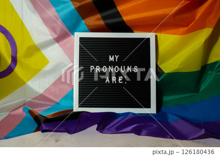 MY PRONOUNS ARE text Neo pronouns concept on Rainbow flag background gender pronouns. Non-binary people rights transgenders. Lgbtq community support assume my gender tolerance equal rights 126180436