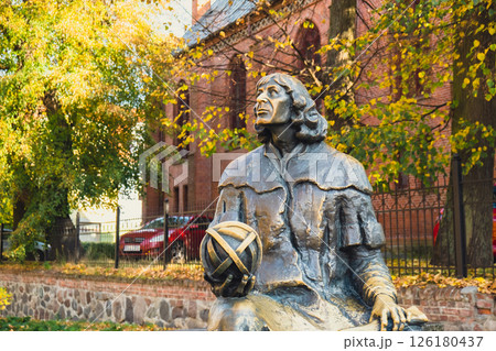 Olsztyn Poland - October 2022 Planet in hand of Nicolaus Copernicus statue near his famous castle. Nicolaus Copernicus statue on the Old Town in Olsztyn. Famous tourist attraction travel 126180437