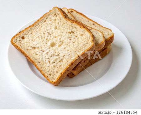 Soft White Bread Slices Stacked on a Plate Soft White Bread Slices Stacked on a Plate 126184554